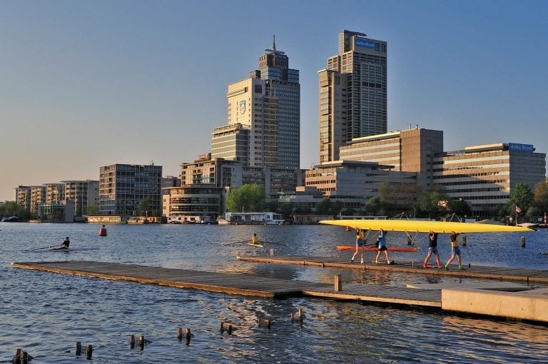 River Amstel with rowing club and Rembrandttower Mondriaantower Breitnertower