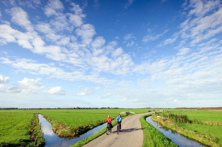 Cyclists near Fort at Krommeniedijk