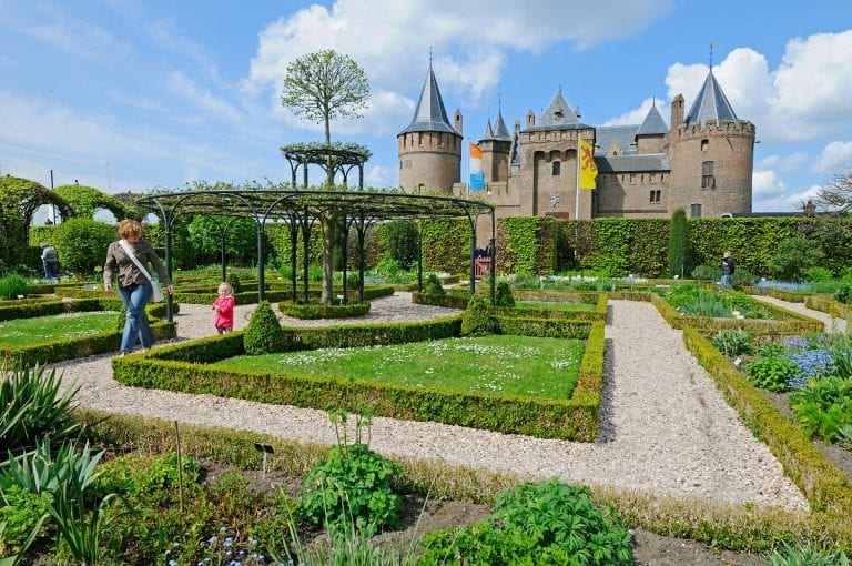 Visitors in vegetable garden of Muiderslot