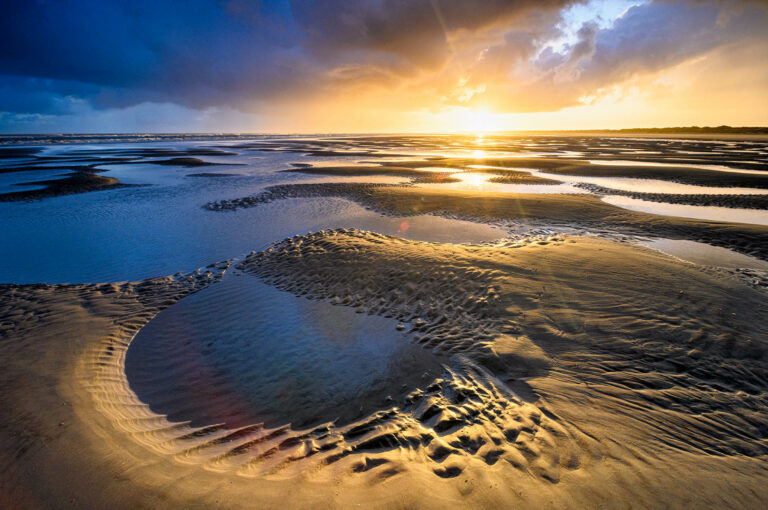 Sunrise above a beach
