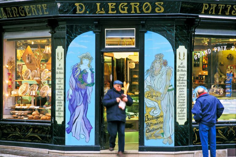 A man walks out of a boulangerie patisserie