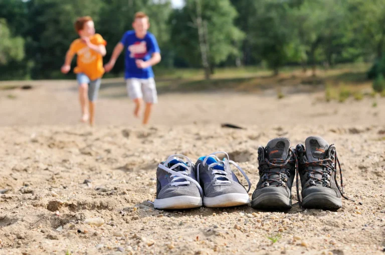 Boys running to their shoes