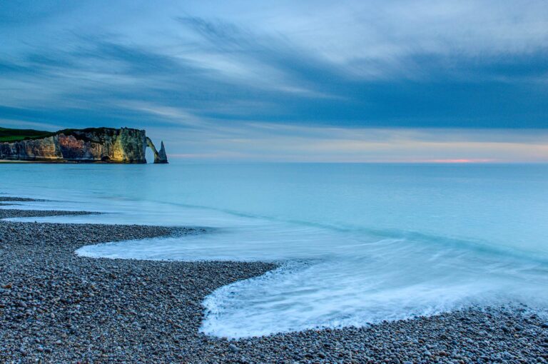 The coast of Etretat with the cliffs Falaise d'Aval and l'Aguille