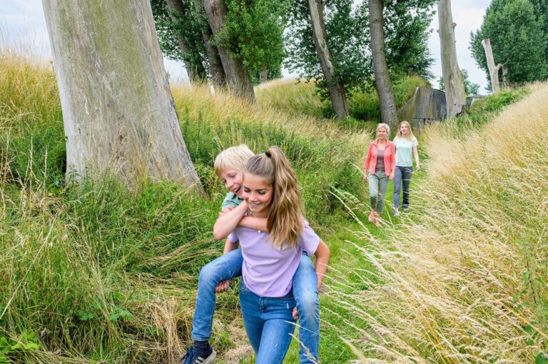 Children playing, walking with their mother at Fort Nigtevecht