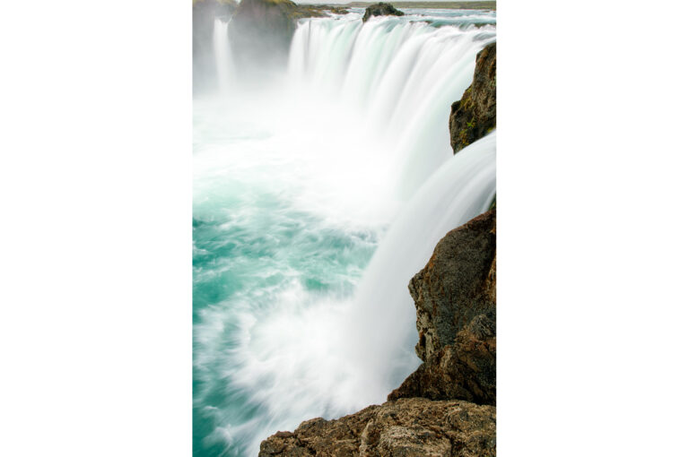 Goðafoss waterfall with long shutter speed for movement in the water, white blur