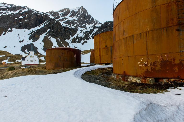 Grytviken storage tanks and Norwegian Lutheran church.