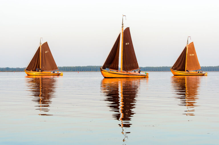 Three botters on lake