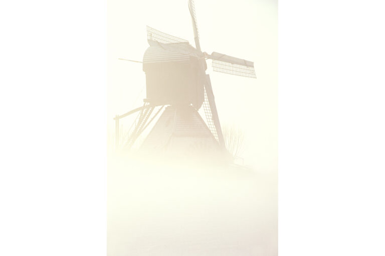 Windmill in fog or mist