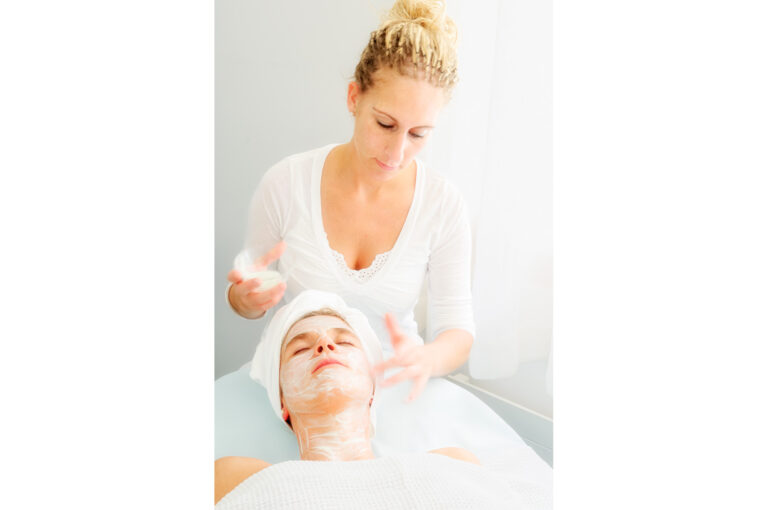 A woman enjoys a beauty treatment