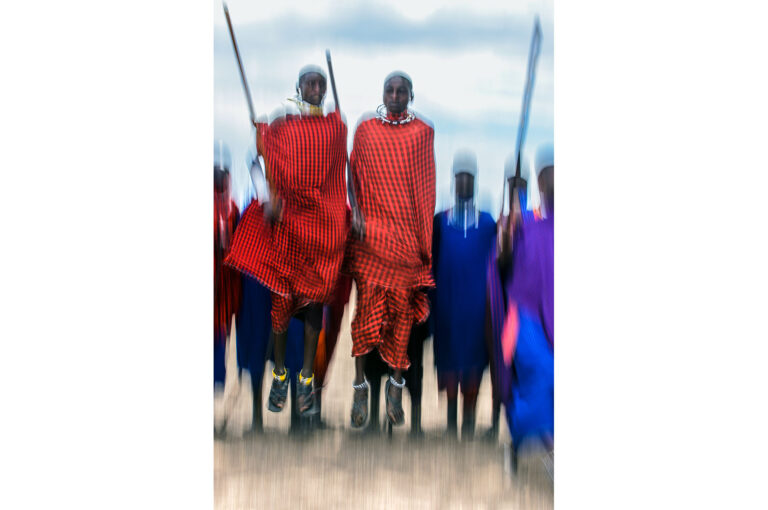 Jumping Masaï men performing a traditional dance