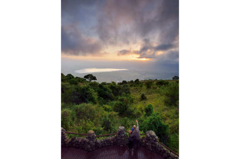 Tourists enjoy the view on the Ngorongoro Crater from the Ngorongoro Serena Safari Lodge