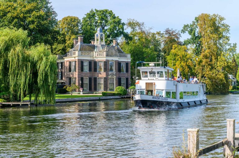 Rupelmonde and tour boat on river Vecht