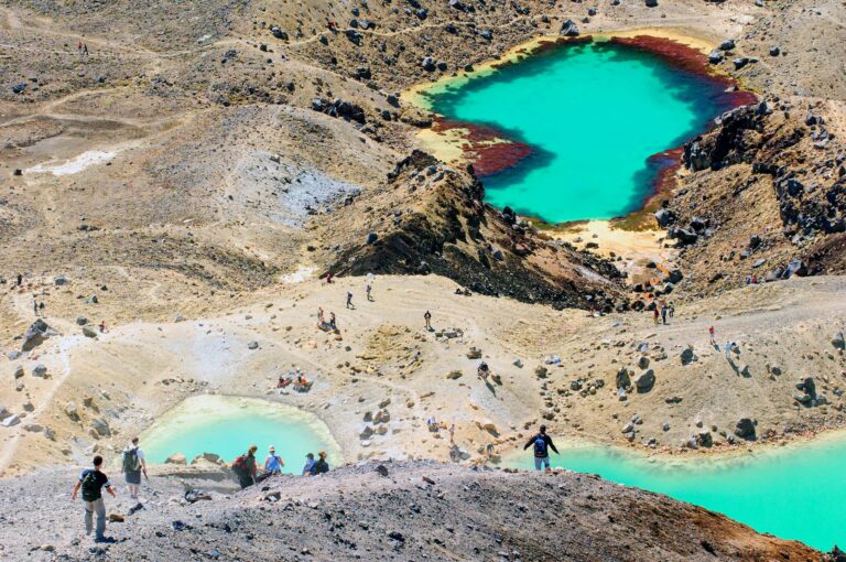 Hikers on the Tongariro Crossing with the emerald coloured lakes
